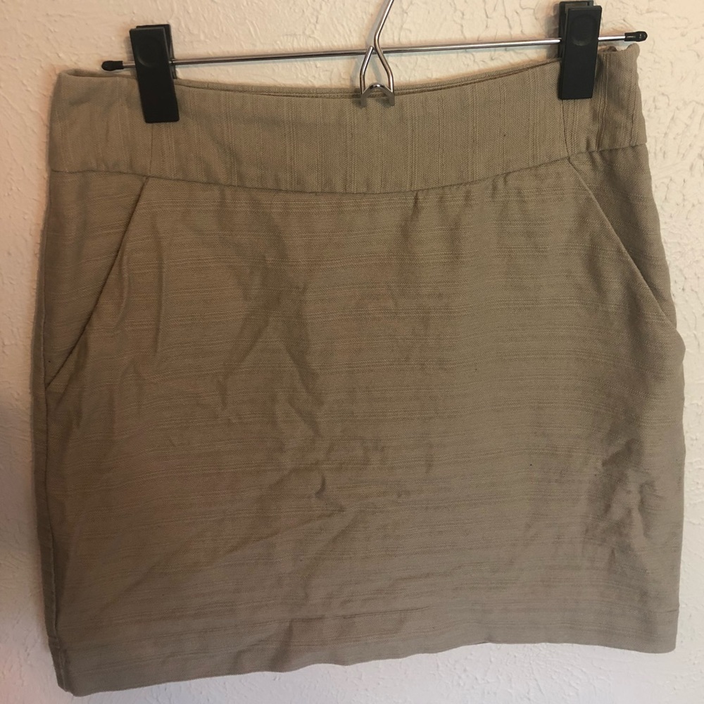 Taupe cotton skirt with polyester lining.